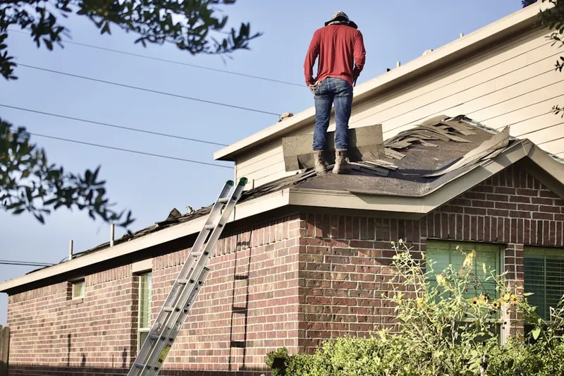 Professional roofer working on a residential roof in Californian